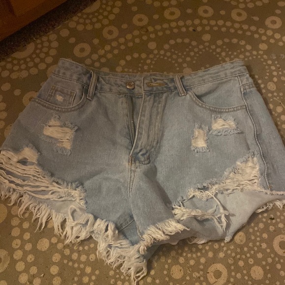 Light washed, ripped, jean shorts. - Picture 1 of 2